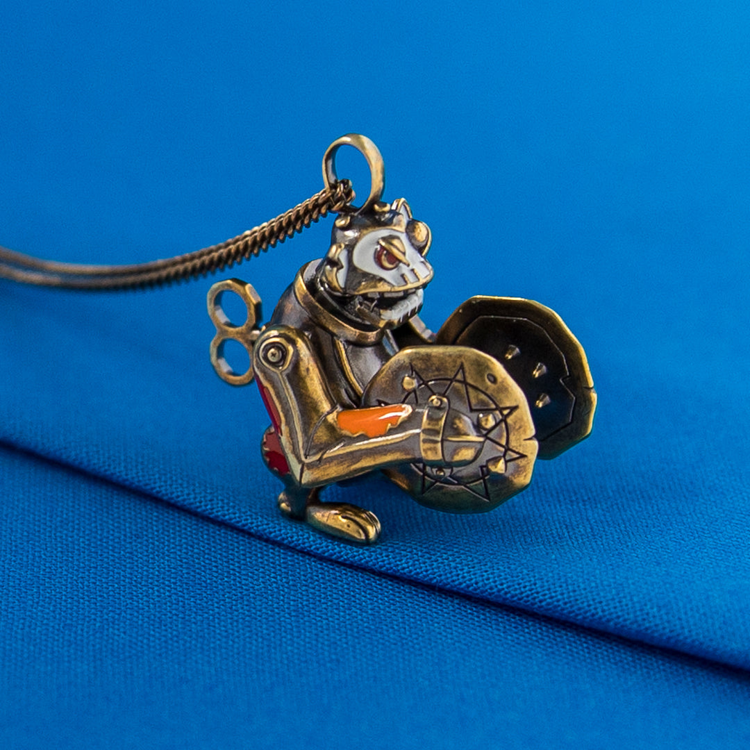 Back of Arcane × RockLove Jinx Monkey pendant revealing mechanical engraving and tail details.