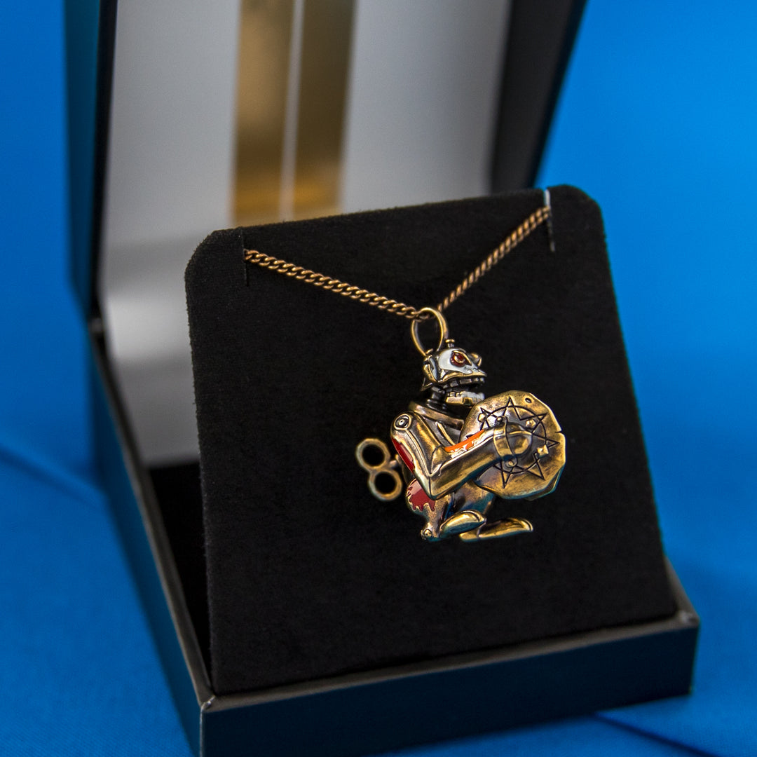 Arcane × RockLove Jinx Monkey necklace resting in the League of Legends ARCANE Collector’s Box with black velvet interior and gold detailing.