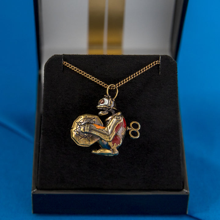 Arcane × RockLove Jinx Monkey necklace displayed in signature League of Legends ARCANE Collector’s Box with gold metallic silkscreened art and black velvet lining.