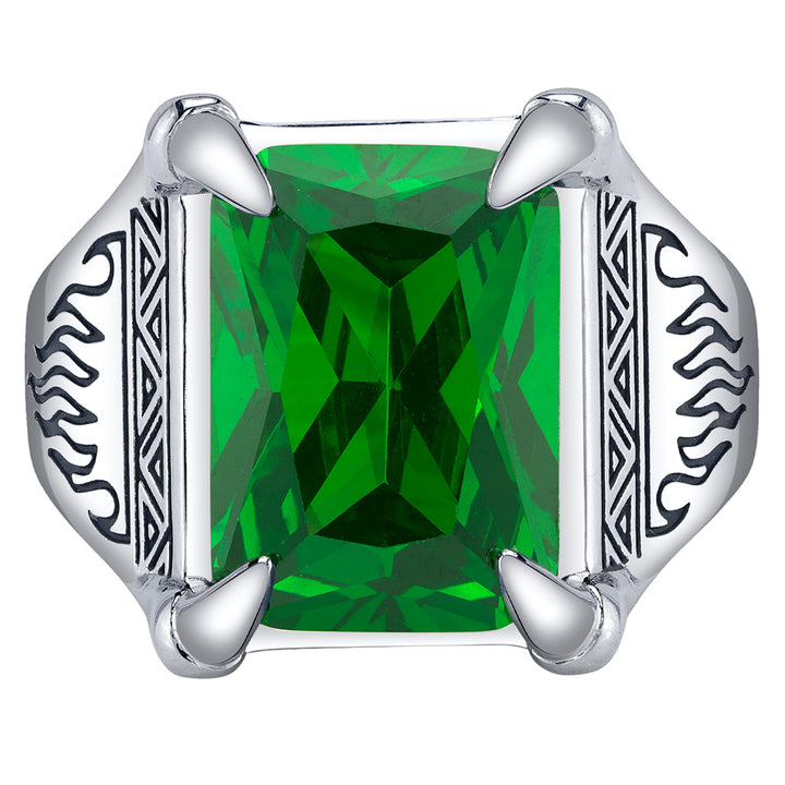 Silver ring with a green gemstone on a white background